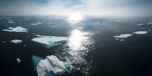 landscape and aerial photography of icebergs on body of water during daytime